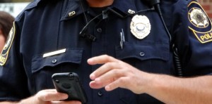 Police on cellphone Charlotte Criminal Attorney Mecklenburg DWI Law Firm