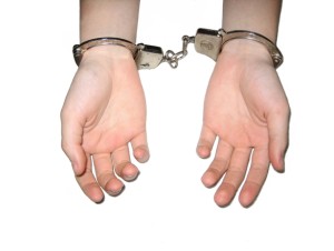 Handcuffed hands Charlotte Criminal Lawyer Mecklenburg Defense Attorney