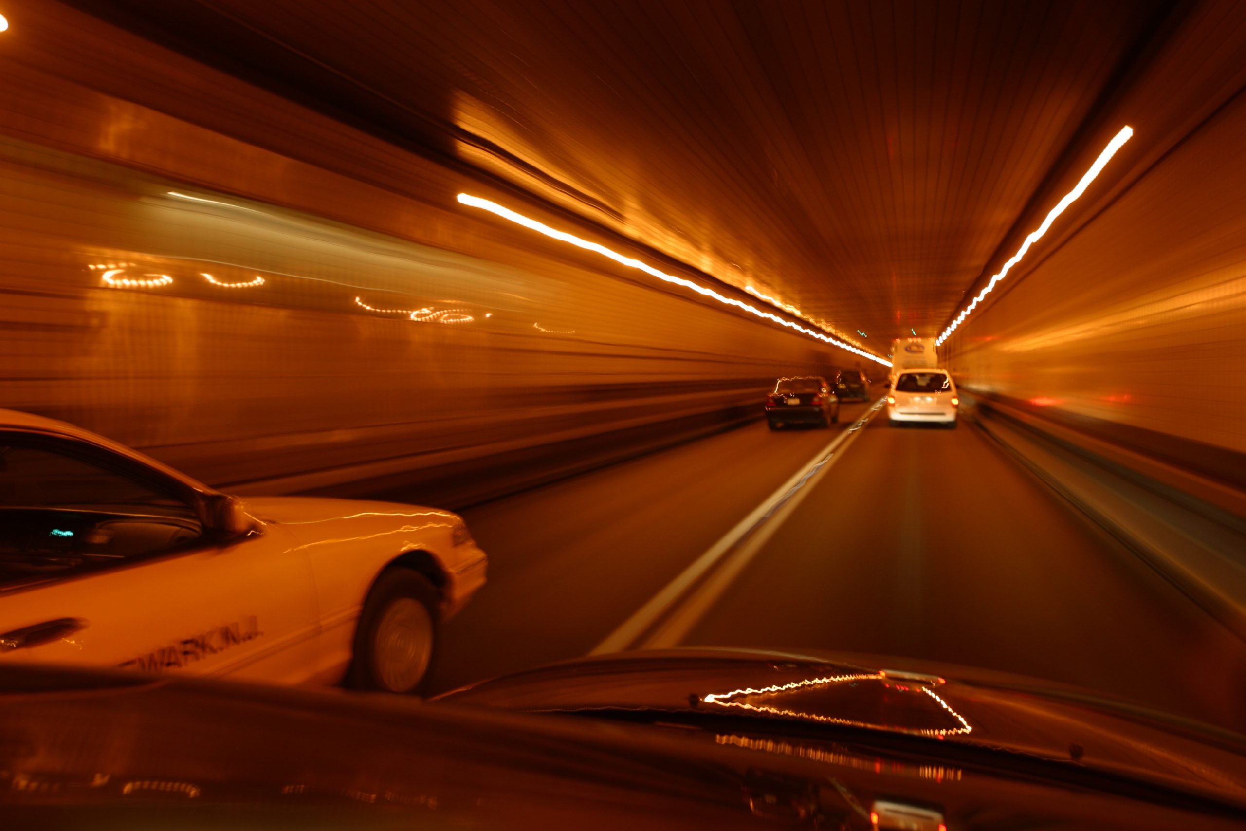 cars-speeding-through-tunnel-1851420-scaled