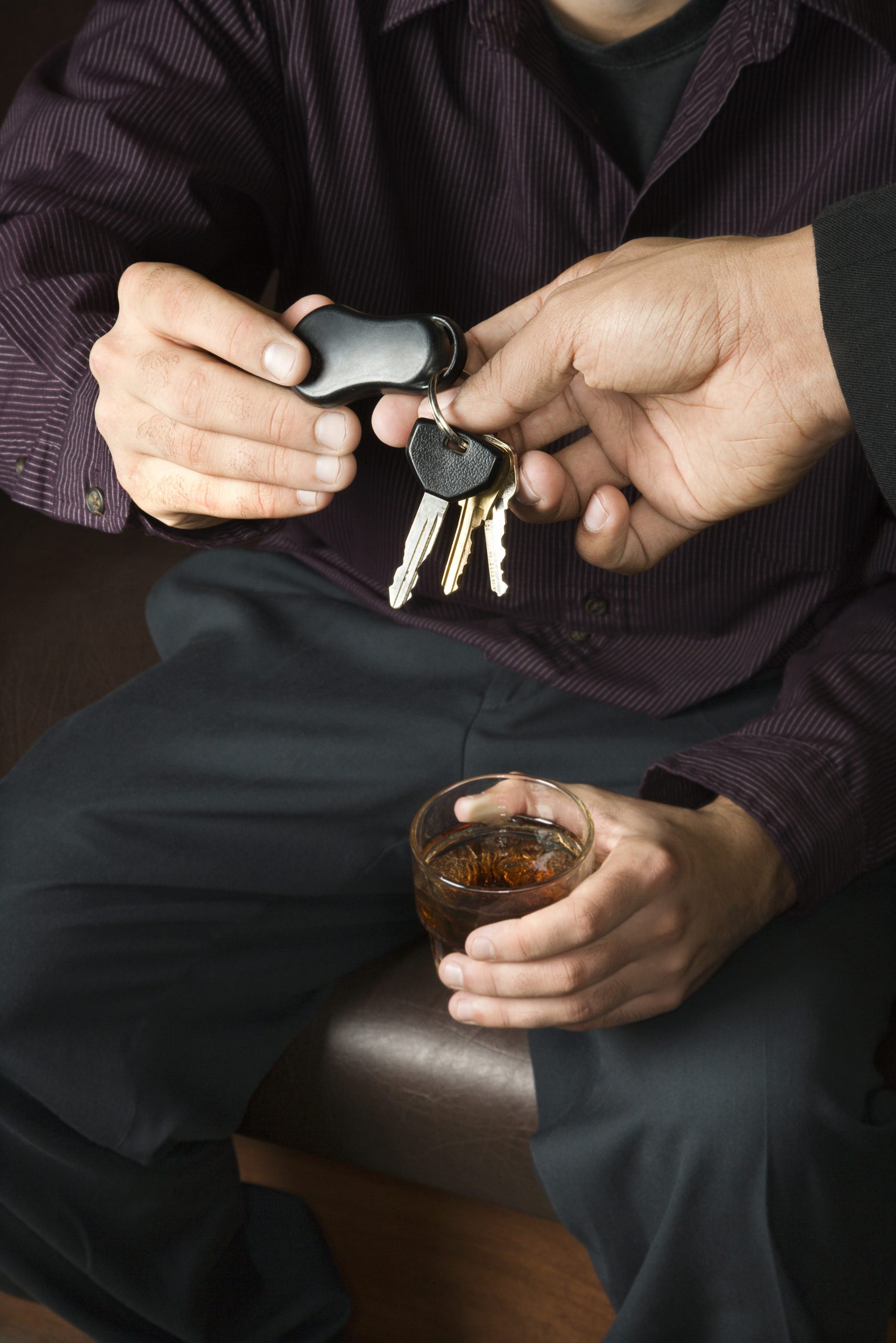man-with-drink-handing-over-car-keys-1951137-scaled